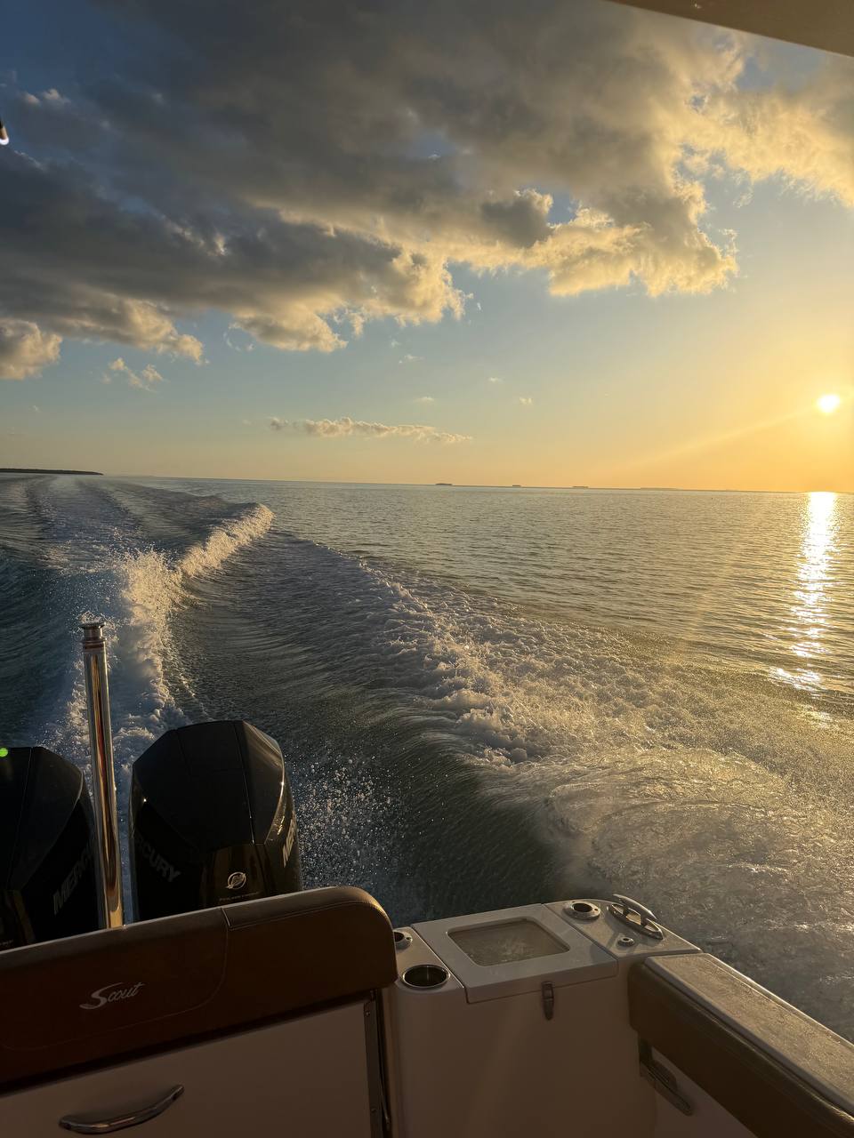 Golden sunset wake behind The Bougie Girl